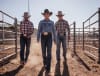 ISA Rodeo riders Jake Curr and Kelsey Pavlou (behind) and Isa Rodeo's Ally Finlay announcing tickets on sale earlier than ever before for the iconic Mount Isa Mines Rodeo_photo at Kalkadoon Arena  