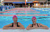 Big Bold Swim participants Ash and Megan dive in for breast cancer research
