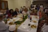 Guests enjoying the iftar dinner at The Logan Iftar 2025, Stockleigh Mosque women's hall.
