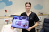 Graduate Nurse Hollie Stein in the JHC Neonatal Unit where she was treated 19 years ago.