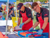 RRT volunteers prepare food for participants