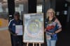 Tiwi Plantations Corporation Chair Gibson Farmer Illortaminni and CDU Northern Institute Research Associate Alicia Boyle with the Tiwi Forestry Workforce Plan 2026-2030.
