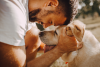 Man hugging dog.