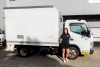 Janelle Parsons with a FUSO truck.