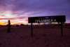 Welcome sign and sunset in Innamincka.