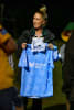 Karly Jenkins wtih one of the Moonshiners jerseys that will be auctioned on July 11 at the Beyond Blue Charity Day in Brunswick Heads