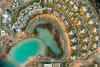An aerial view of Six Senses AMAALA and its surrounding shoreline at Triple Bay