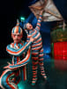 Queensland's Mitch Wynter as The Trickster with The Innocent (with kite) in KOOZA by Cirque du Soleil  