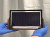 The research team's commercially sized indium-free tandem solar cell, which achieved a certified efficiency of 31 per cent using abundant tin oxide in place of scarce indium. Image: Monash University
