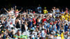 Fans hold up a 'beer snake' made of plastic cups during a Test match at the Melbourne Cricket Ground © PA Images / Alamy Stock Photo