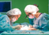 The SENOMAC trial showed that a less invasive surgical approach reduced post-operative complications.
