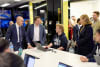 CyberCX CEO John Paitaridis (L) and Monash University Vice-Chancellor Professor Sharon Pickering (R) in conversation with Monash University cybersecurity student Nick Lewis during the launch event. 