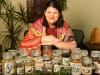 Proud Wiradjuri woman and gin distiller Clair Ryder with bush tucker ingredients drawn on at On Country Gin Distillery - presenting the "Bush Alchemy' event of National Science Week.