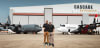 Britton Coulson, left, and Wayne Coulson stand in front of one of 10 former Royal Canadian Air Force CC-130H Hercules aircraft recently acquired by Coulson Aviation from the Government of Canada. At right is a Coulson C-130H outfitted for aerial firefighting with the company's proprietary RADS-XXL retardant delivery system, capable of carrying up to 4,000 U.S. gallons, or more than 15,000 litres, of water or fire retardant. The acquisition doubles Coulson's global C-130H fleet to 20 aircraft, expanding its