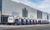 A fleet of Gatik's autonomous trucks at a customer distribution center