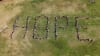 Milton State School students form the word 'hope' on their school oval in support of the Act for Kids Stadium of Hope campaign. Picture: Tom Pawson