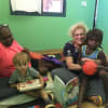 Sharing reading in the Outback with Susanne Gervay OAM, the grandma and the First Nations brother.
