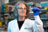 Professor Marnie Blewitt analysing a slide used in her study that has found a potential way to treat Prader-Willi syndrome - a rare genetic disorder that remains with limited treatment options and no cure. 
Credit: WEHI 