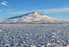 Sea ice off Victoria Land, Antarctica, with Mount Melbourne in the background. (Image: Alberto C Naveira Grabato)