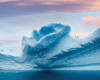 A group of penguins atop an iceberg in Antarctica