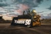 Thiess3.jpg: The 6,000th Cat D11 dozer at Thiess' Lake Vermont mining operations, flying the Thiess 90th anniversary brandmark