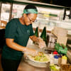 Zambrero team prepping one of our burritos