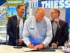 Thiess 1.jpeg: Thiess Group Executive - Americas Darrell White, signing the decarbonization agreement between Thiess and FLANDERS at MINExpo 2024