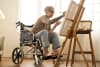 Tattoo woman in a wheelchair painting