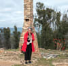 Jan Harris, a founding member and board member of Bushfire Survivors for Climate Action, stands on the ruins of her Tarthra home which was lost in the 2018 Reedy Swamp fire.