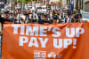 Mineworkers rally outside BHP's AGM in Brisbane. 