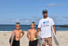 From L-R, brothers Aloha and Lakey Haddon with their dad Joe at Nine Mile Beach, Tuncurry. Lakey is competing at the Reflections Cadet Cup at this beach, and his brother Aloha is hoping to join him. 