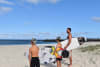 L-R Aloha and Lakey Haddon with their Dad, Joe, at Nine Mile Beach, Tuncurry. Lakey is competing at the Reflections Cadet Cup at this beach, and his brother Aloha is hoping to join him. 