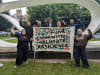 Community photo taken outside the Melbourne Resilience Inquiry hearing with Act on Climate's Fund Community Climate Resilience banner
