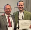 Professor Henning Madry hands the Clinical Research Publication of the Year Award to  Magellan Stem Cells Chief Medical Officer Associate Professor Julien Freitag in South Korea.