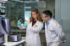 Olivia Moscatelli and Associate Professor Jason Tye-Din with the highly sensitive technology used in their study to detect the critical IL-2 signal.
Credit: WEHI
