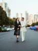 Aarron & Robert's wedding attire featuring Melbourne skyline
