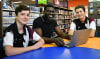 "I saw how much of a difference the right support made for me, and I knew I wanted to be that person for others," Dr Michael Ayodeji Ifarajimi said. Pictured with Taminmin College students Ethan Halfpenny (left) and Dean Ralph (right).