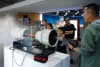Staff giving visitors a live demonstration of wind tunnel testing