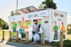 Family recycling at ACT CDS drop and go pod.