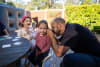 Hearing Australia team member performing hearing tests on First Nations children.