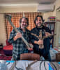Sir Peter Jackson and Ben Lamm (CEO and Co-Founder of Colossal Biosciences) holding South Island Giant Moa bones.