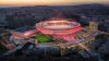 Benfica - New masterplan for the Estádio da Luz Stadium, designed by Populous: Night-time aerial image.
