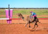Racing camel Polished Copper, ridden by third-generation cameleer Emily Sansome, from near Newcastle, taking the JUNDAH CUP as part of the Desert Champions Way Trail   