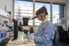 Study second author Jill Chmielewski inspecting dissected mosquito midguts for evidence of parasite fertilisation.