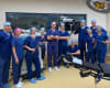 Dr Joe Coory (middle) and the surgical team