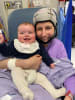 Dr. Claire Clark holds her 5-month-old son, Sam, while receiving one of her 35 rounds of chemotherapy. She was diagnosed with breast cancer when Sam was just five weeks old.