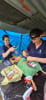 Dr. Claire Clark performs a dog spay during an Animals Fiji outreach clinic in Nacula Village, Yasawa Islands, assisted by volunteer veterinary nurse Daniela Garro (Nov 2024).