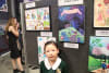 Cynthia pictured with her art.