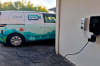 A TOMRA electric van charges on an MSI 7kW unit installed and managed by NOX Energy.
