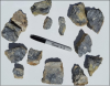 Figure 1; Photo of small subset of the 23.1kg composite sample collected for metallurgcal testwork. Light grey mineral is stibnite (antimony sulphide). Composite average sample grade is 9.6% Sb.